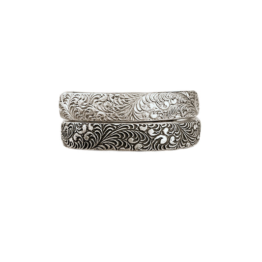 Feathered Sterling Silver Stacking Rings featuring burlesque style feather pattern shown in bright (top) & antiqued (bottom) sterling silver finishes.