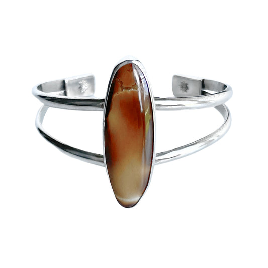 Treasure Mountain Turquoise Silver Cuff Bracelet - front view - the elegant long oval shaped turquoise takes center stage in a simple setting on a sturdy double band sterling silver cuff.