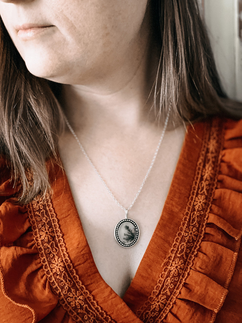 Dendritic Agate Sterling Silver Necklace - worn hanging from neck.