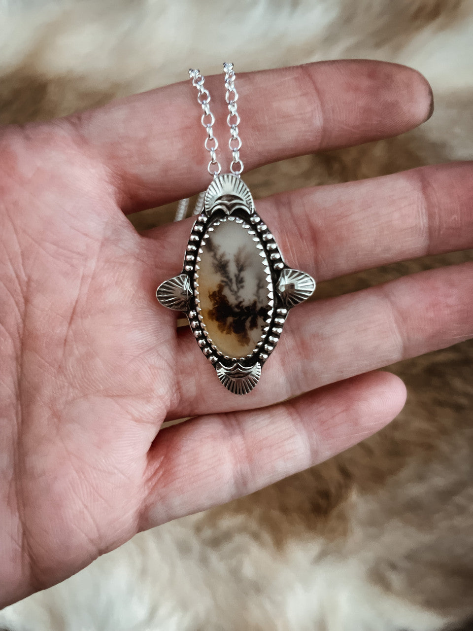 Dendritic Agate Sterling Silver Necklace - the elegant oval agate is accented with an array of stamped radiant line silver cut outs and silver beads all around.