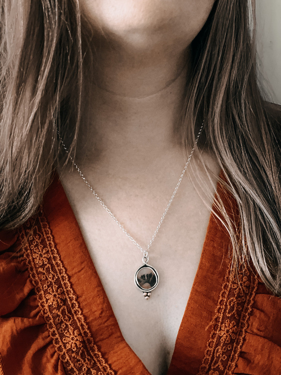 Dendritic Agate Sterling Silver Necklace - worn hanging from neck.