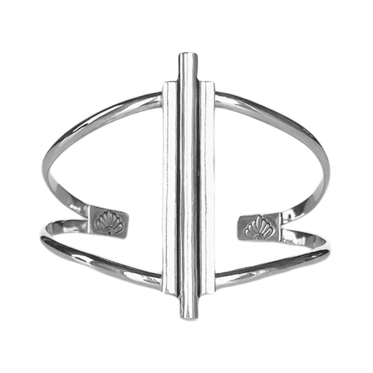 Art Deco inspired sterling silver cuff bracelet. The focal is a 3 bar design with the middle bar slightly longer than the 2 side bars. The cuff features a double band with stamped accents on the ends.
