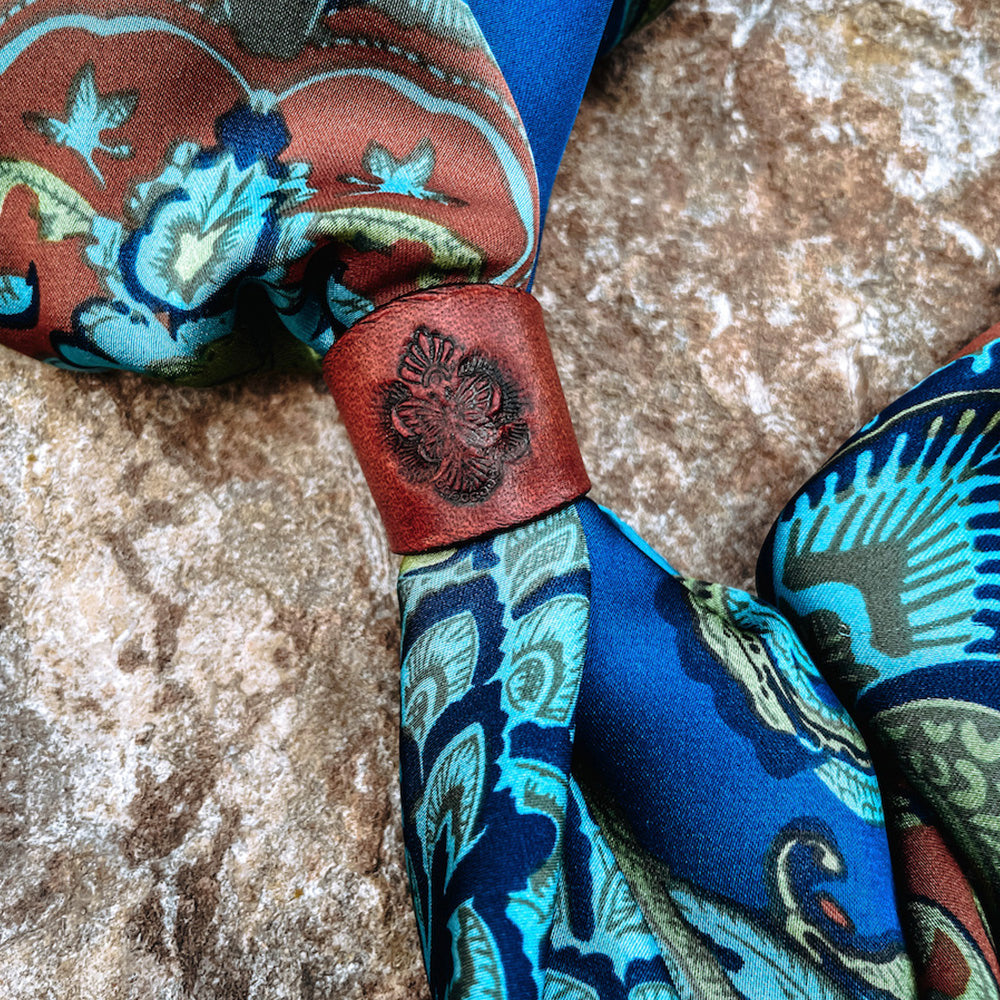 Deep rustic red stamped leather slide on multicolor silk bandana.