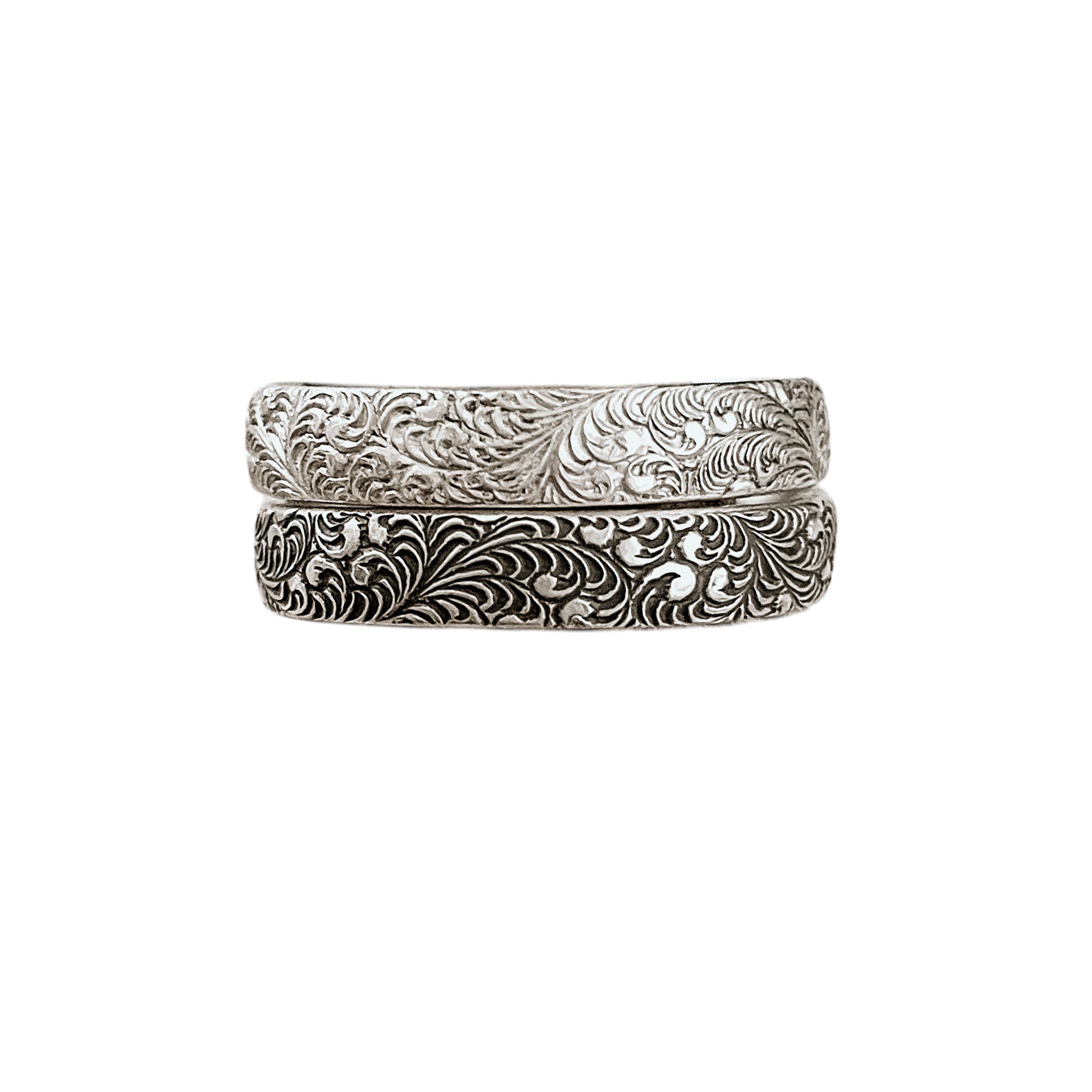 Feathered Sterling Silver Stacking Rings featuring burlesque style feather pattern shown in bright (top) & antiqued (bottom) sterling silver finishes.