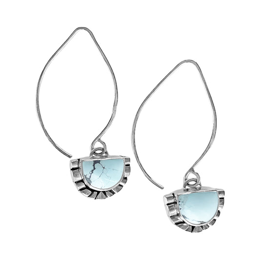 Pair of half moon pale blue turquoise dangle earrings featuring hand-shaped silver moonbeams accenting the curves of the stones and handcrafted marquise-shaped ear wires.