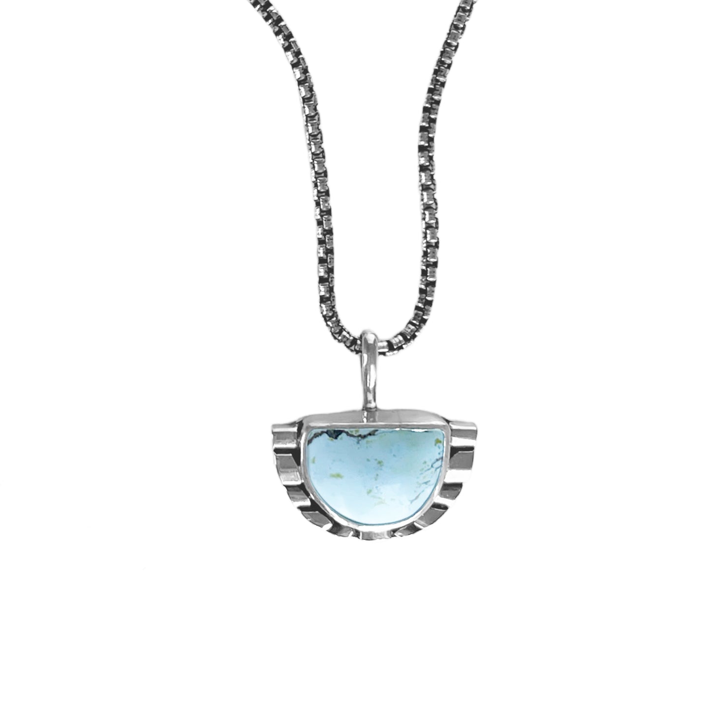 Half moon pale blue turquoise pendant necklace featuring hand-shaped silver moonbeams accenting the curves of the stone on a sterling silver rounded box chain.