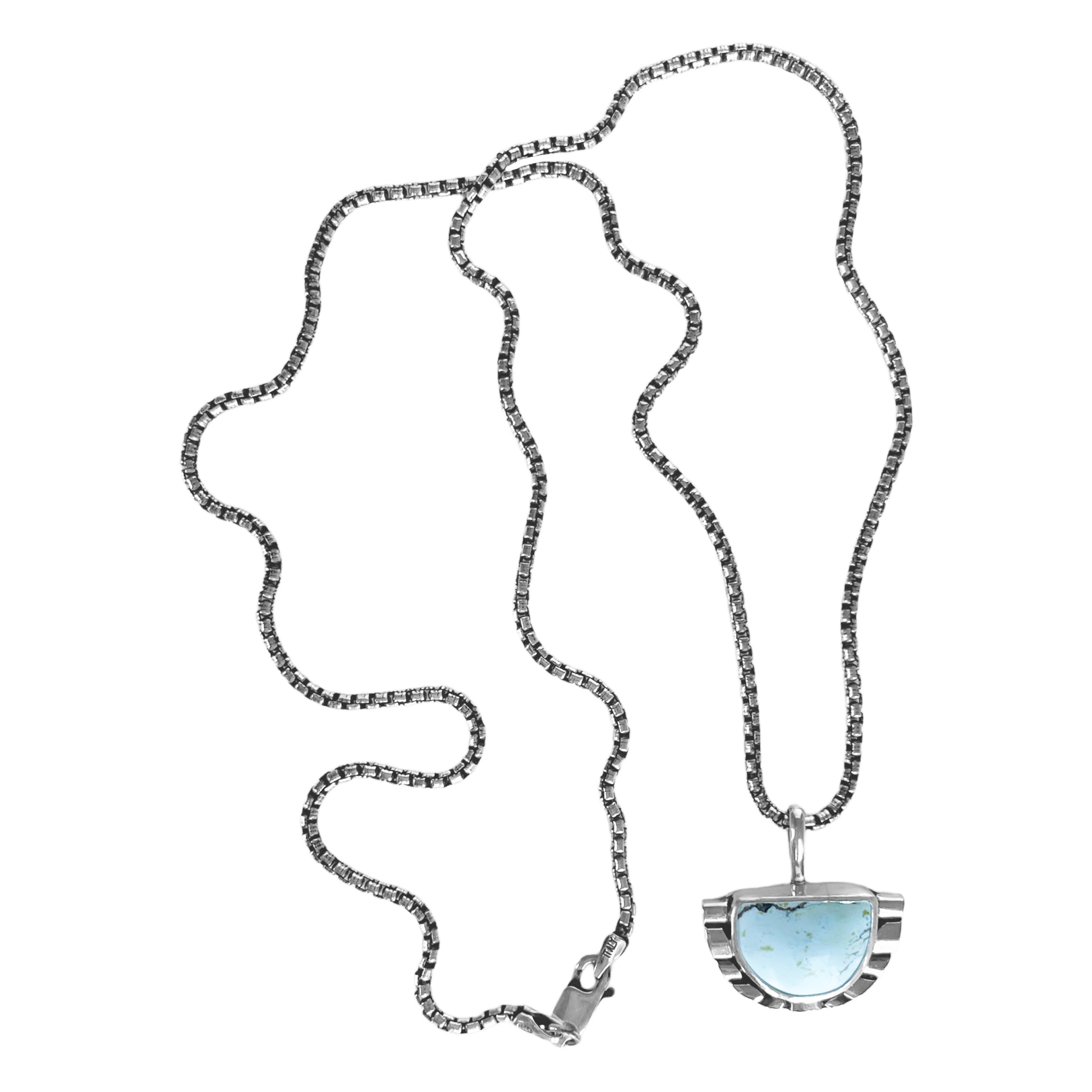Half moon pale blue turquoise pendant necklace featuring hand-shaped silver moonbeams accenting the curves of the stone on a sterling silver rounded box chain.