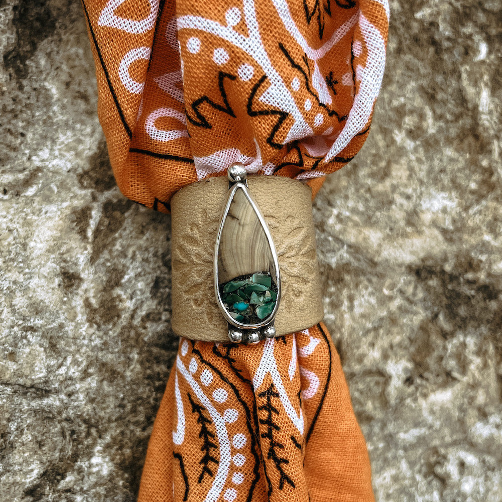 Teardrop wood & turquoise cabochon set in sterling silver on natural stamped leather slide on orange bandana.