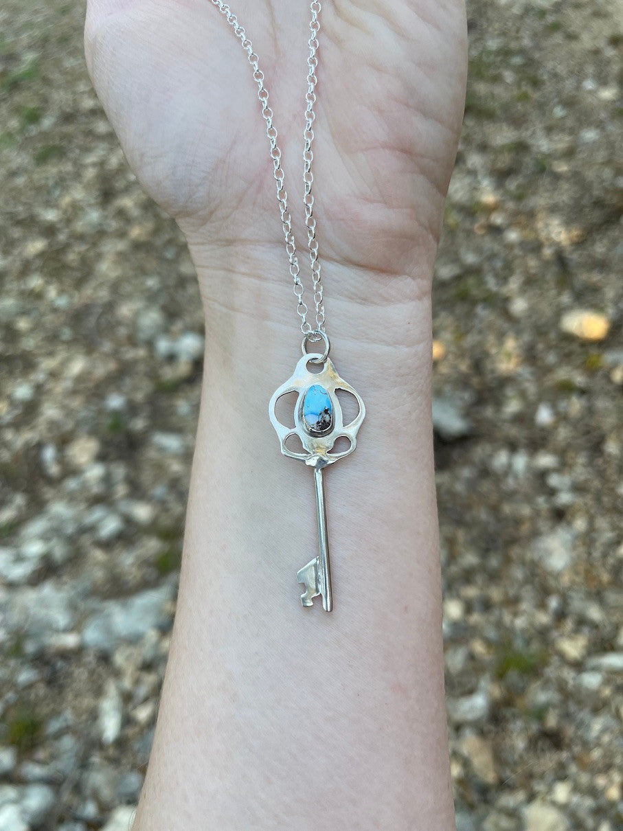 Skeleton Key Necklace with Golden Hills Turquoise - shown outdoors in natural light.